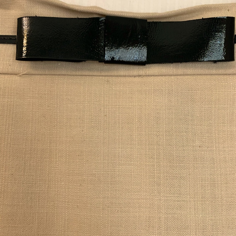 Patent leather bow topped pencil skirt. Size 6.